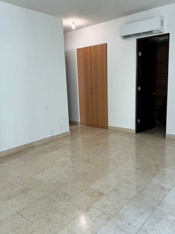 Bedroom with built-in storage and split air conditioning at Pacific Village Punta Pacifica