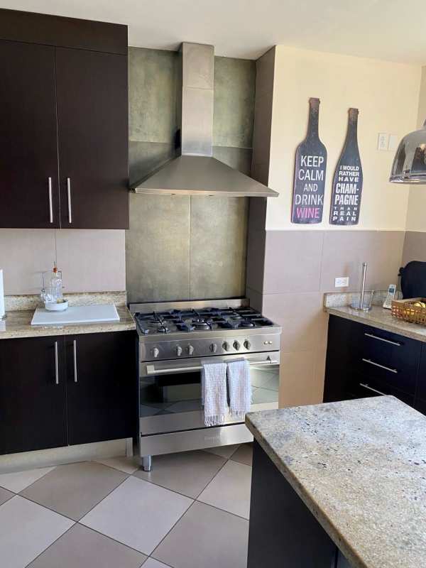 Panoramic city skyline view balcony with outdoor seating in PH Elite La Cresta Bella Vista