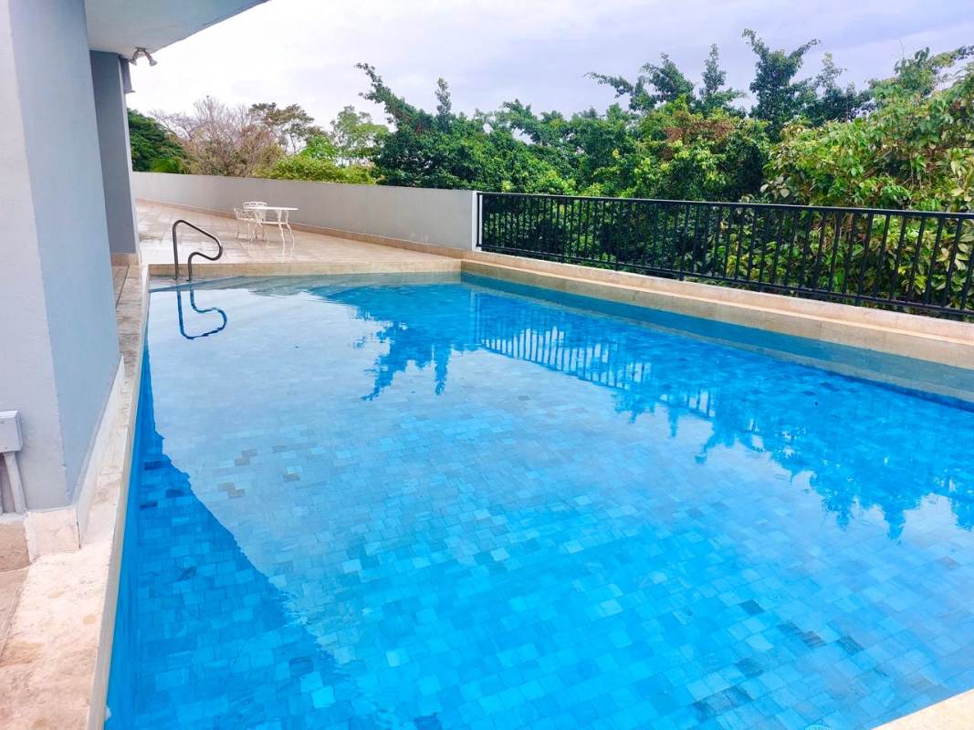 Swimming pool with sun deck and garden at PH Edificio Elite La Cresta Panama City