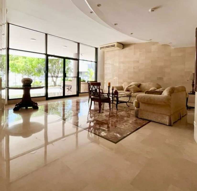 Living room with marble floors, balcony access and panoramic windows PH Edificio Elite Panama City