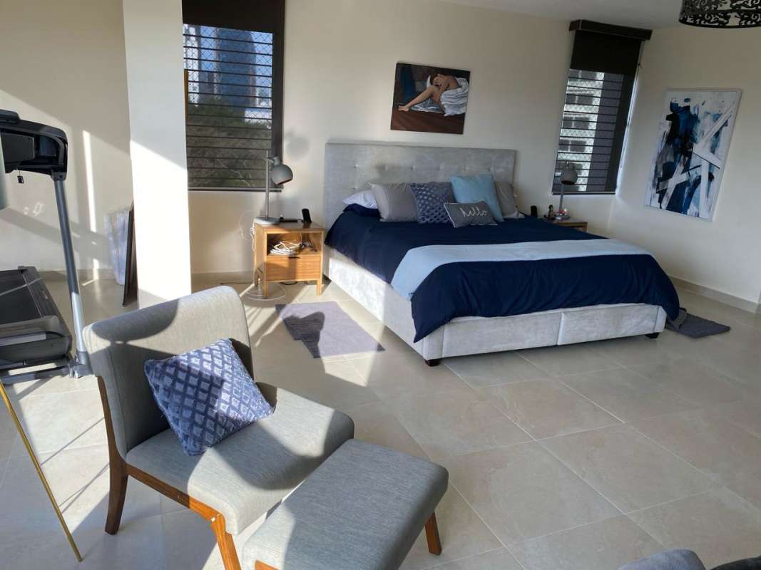 Spacious master suite with large windows and balcony PH Edificio Elite La Cresta Panama