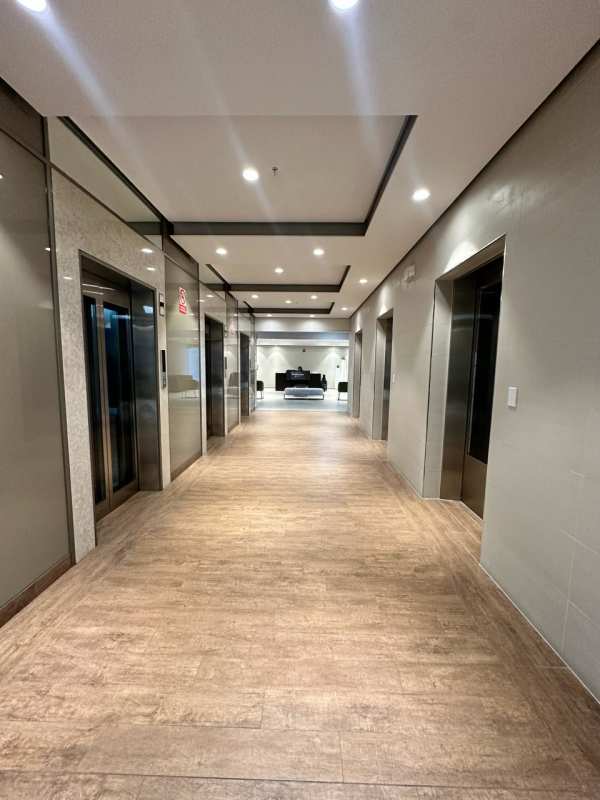 Modern elevator lobby with multiple elevators at Town Center in Panama City