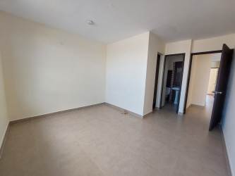 Spacious bedroom with large window and tile flooring in house for sale La Chorrera Panama