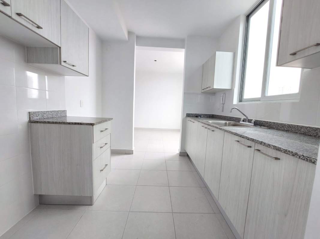 Minimalist white kitchen with granite counter and window PH Solok Panama