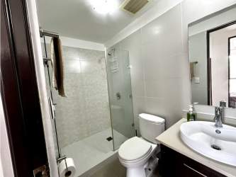 Full bathroom with glass shower PH Mosaic apartment Panama Pacifico