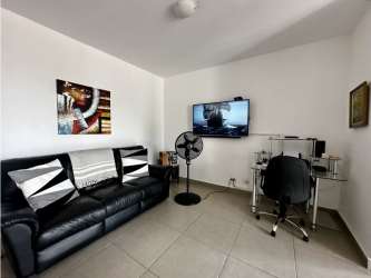 Living room with home office setup PH Mosaic Panama Pacifico
