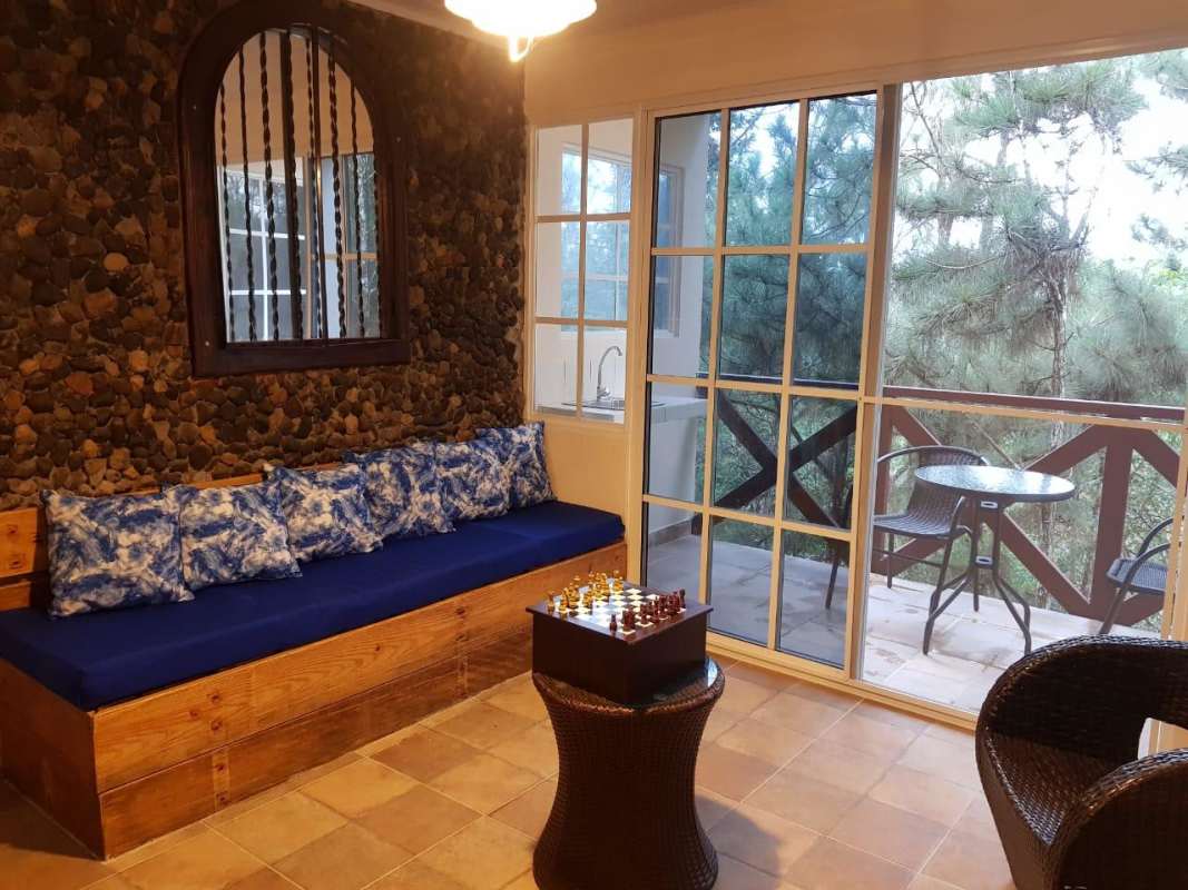 Mountain view sunroom with patio doors to balcony in Altos de Cerro Azul Panama
