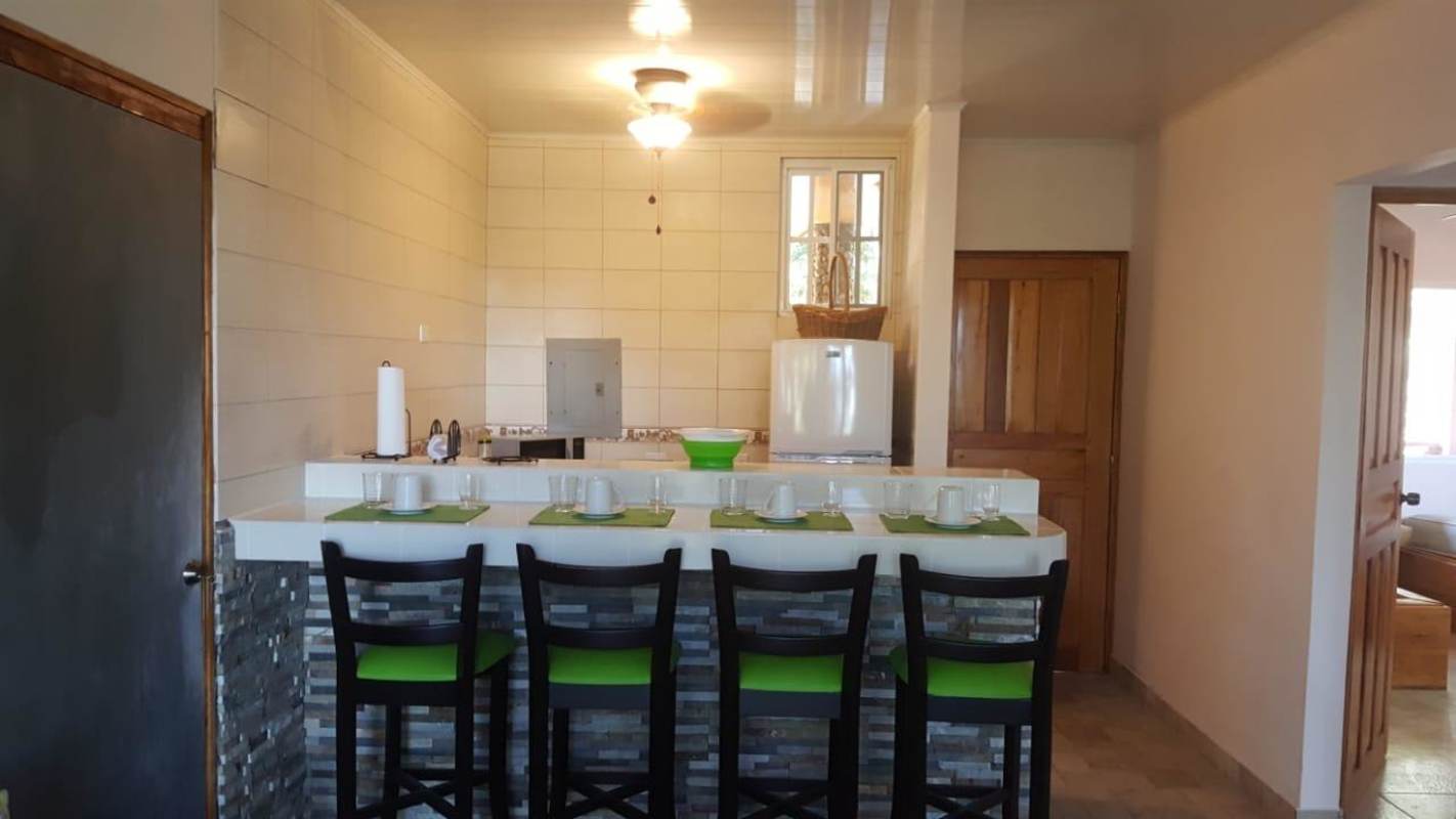 Front porch and wooden entrance of mountain home in El Alcázar Cerro Azul Panama