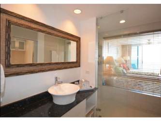 Spacious modern bathroom with vessel sink, granite countertop, glass shower at PH Coronado Bay