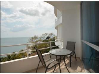 Glass-railed curved balcony with panoramic Pacific coastline views PH Coronado Bay Panama
