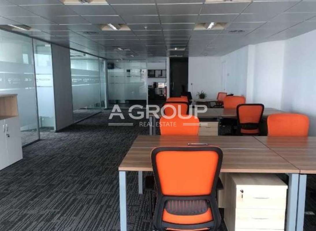 Commercial office with modular workstations and glass partitions in Oceania Business Plaza