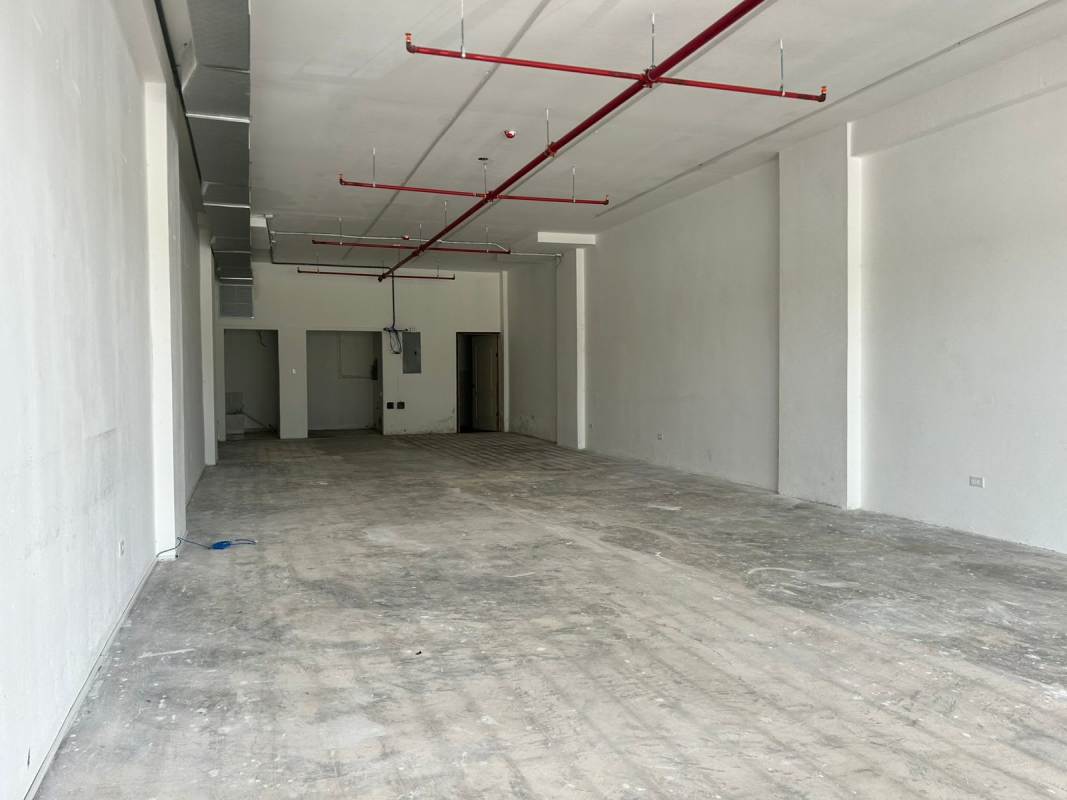 Shell commercial interior with exposed sprinklers, utility space and concrete floor in Tocumen Panama