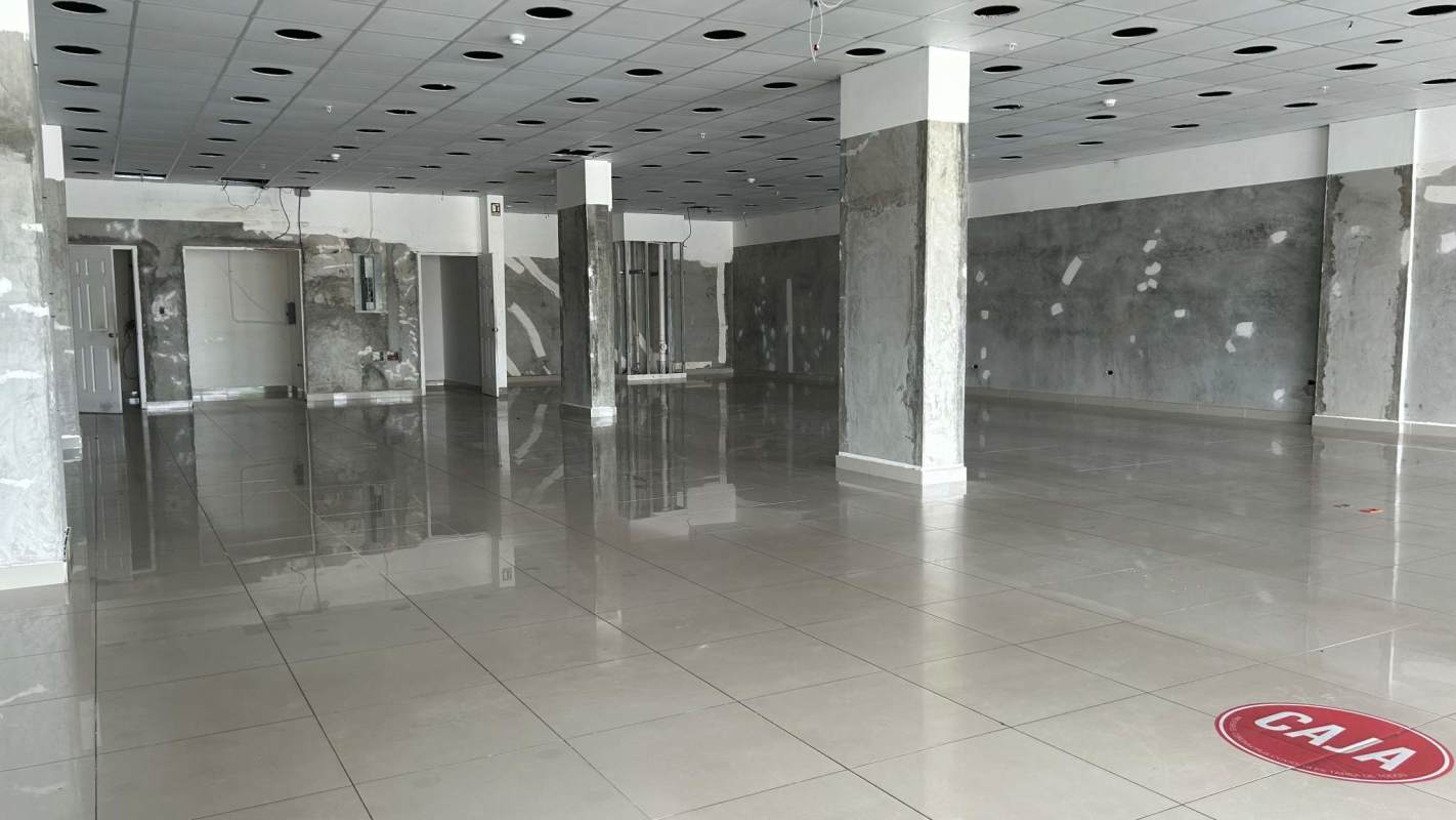 Unfinished spacious retail interior with tiled floors and high ceilings Plaza Las Americas Panama