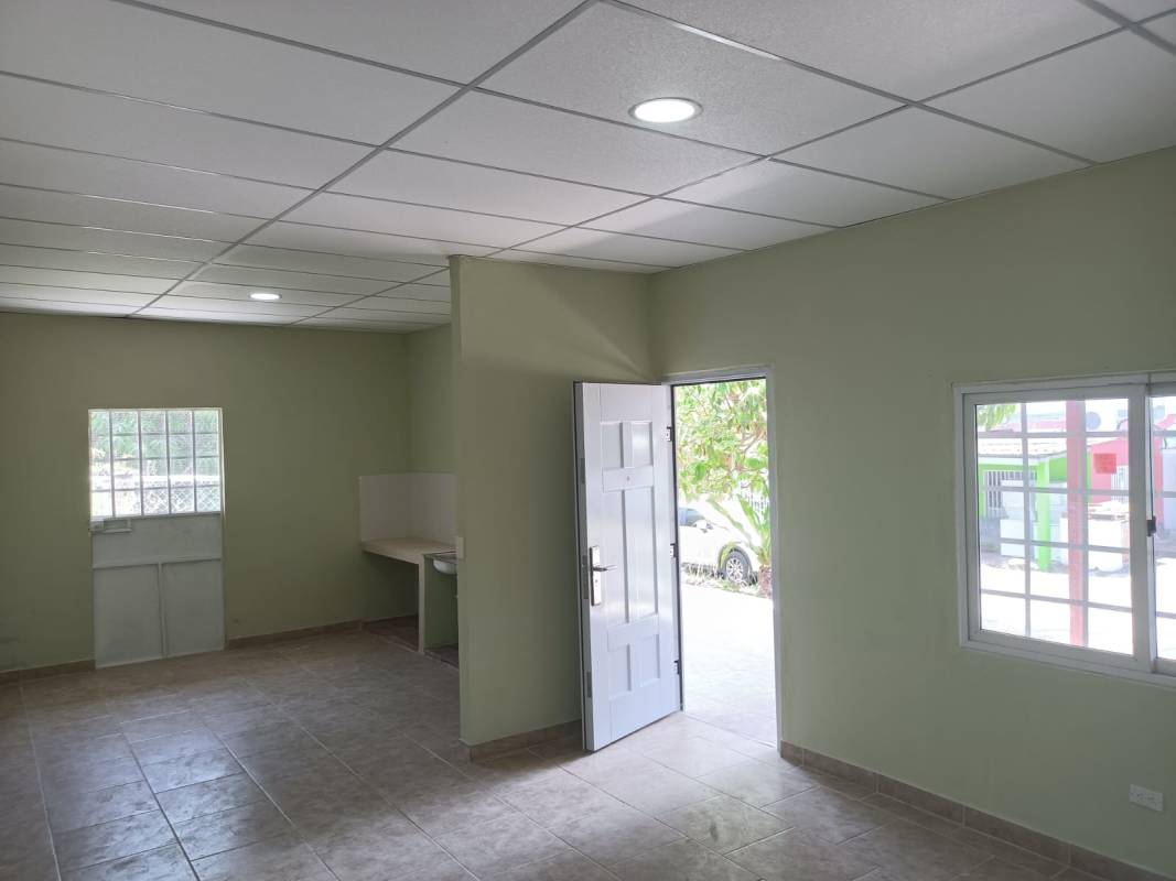Breakfast bar, granite counter, and hall in Monterrico house Tocumen Panama