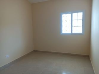 Simple empty bedroom with tiled floor in budget house Valle de Los Cerezos Panama