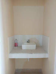 Compact bathroom with tiled walk-in shower affordable home Panama