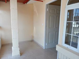 Front of remodeled small house with gate and porch in Valle de Los Cerezos Vacamonte Arraiján