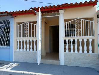 Empty living space with tile floor and neutral colors at affordable home in Vacamonte Arraiján