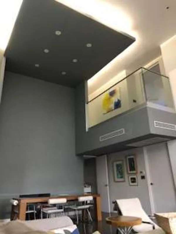 Modern loft with double height ceiling, mezzanine and open living dining PH Porta Nova Panama