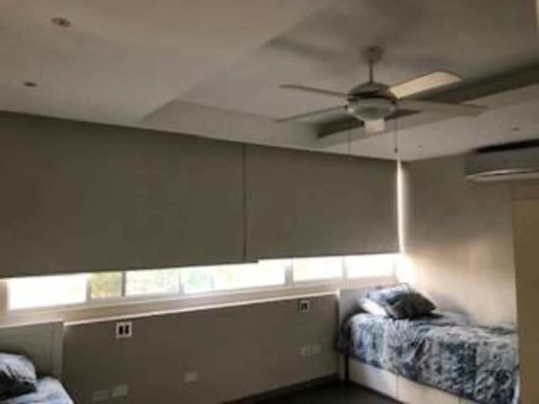 Master bedroom with large bed, ceiling fan, closet PH Porta Nova Via Argentina