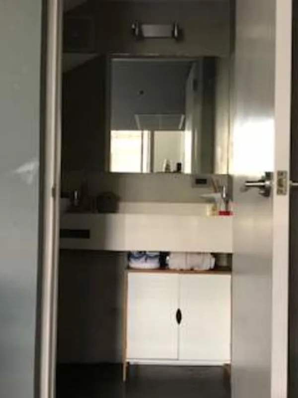 Contemporary bathroom with large mirror and vanity in PH Porta Nova Via Argentina