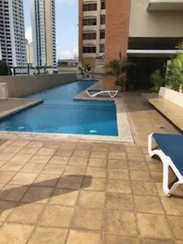 Outdoor pool area with city views and lounge chairs PH Porta Nova Panama