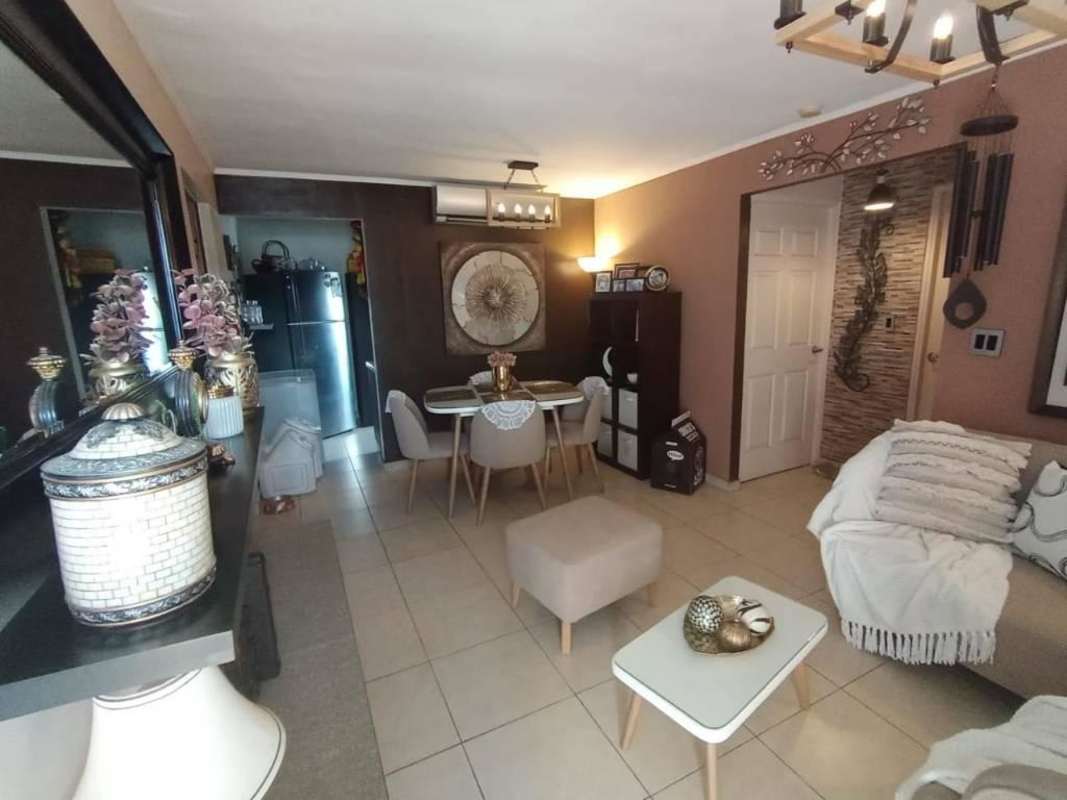 Bright living dining room with tile floors and large balcony in PH Rio Abajo Residences Panama City