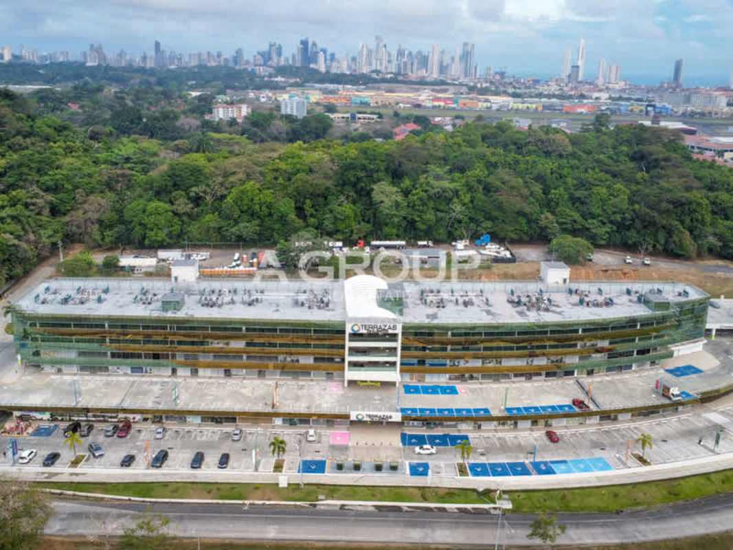 Aerial of Terrazas de Albrook commercial building with glass facade and parking Panama City