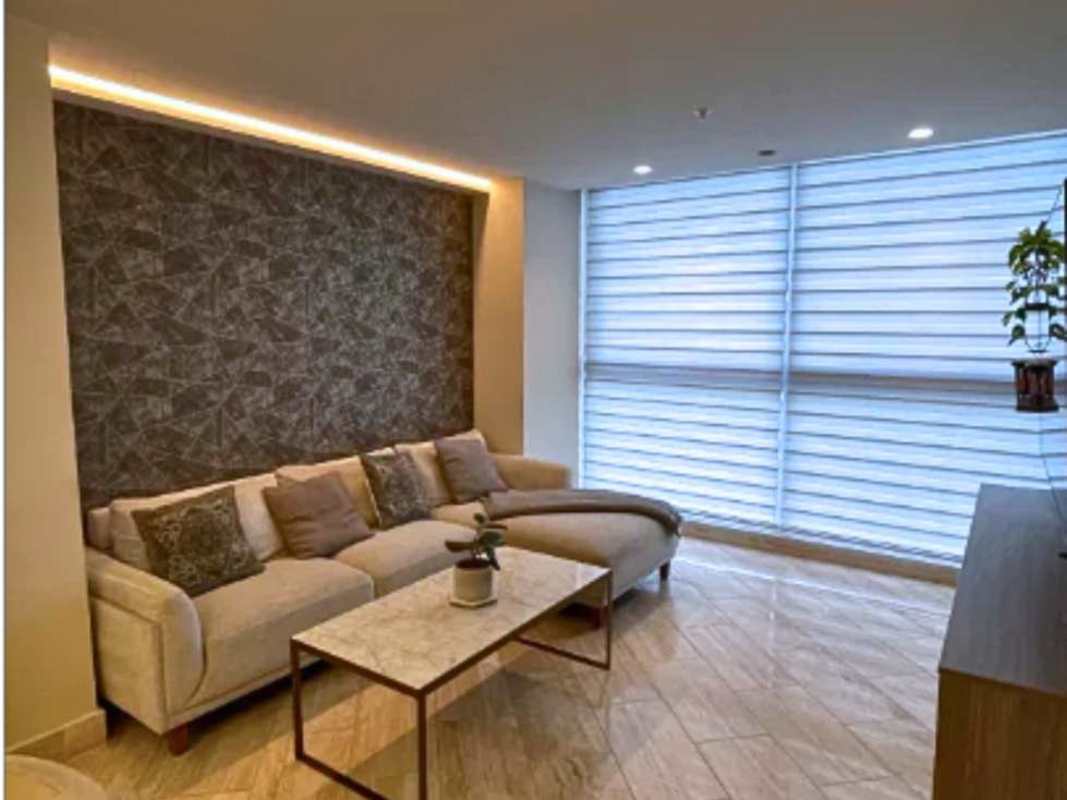 Furnished dining and living area with ocean view windows in PH The Regent Costa del Este Panama