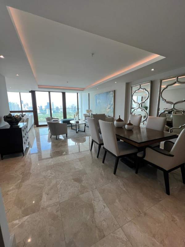 Master bedroom with large windows and walk-in closet at PH The Colonial Santa Maria Panama