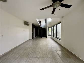 Modern bathroom with soaking tub, double sinks, glass shower enclosure in PH Nativa house