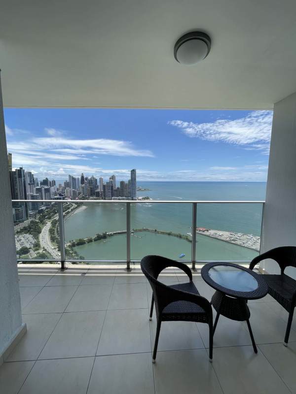 Bright living room with sectional sofa and panoramic ocean views PH White Tower Avenida Balboa Panama