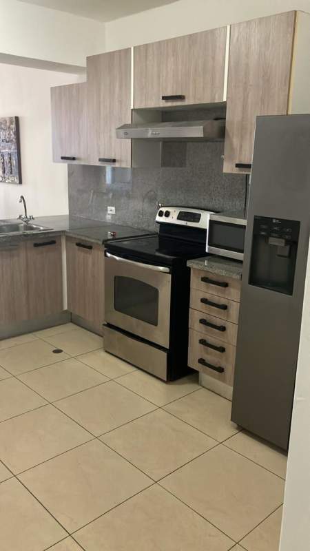 Kitchen with granite countertops and stainless steel appliances at PH White Tower Panama