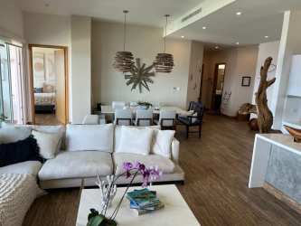 Spacious kitchen island with pendant lighting, modern cabinetry and stainless appliances in Playa Escondida beach condo Panama