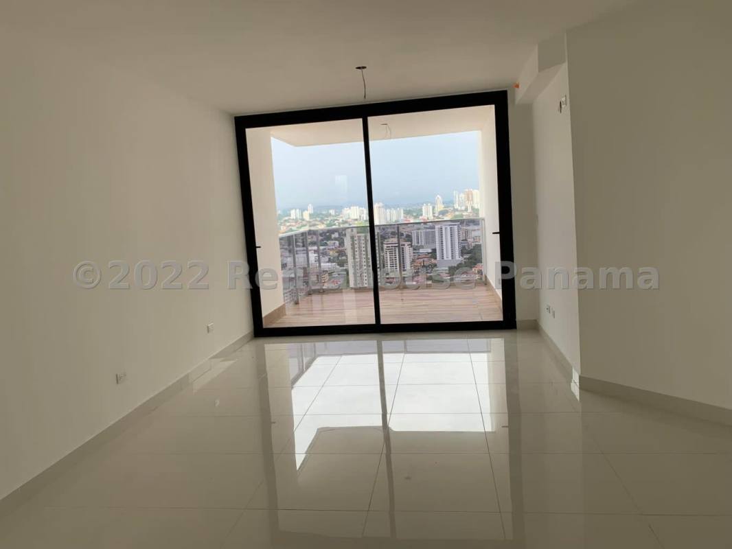 Bright bedroom with built-in wardrobe and window city view PH Vía Argentina