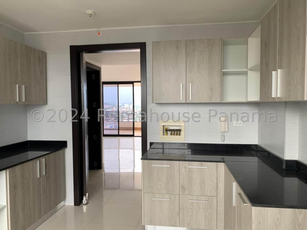 Modern kitchen with granite countertops wood cabinetry in PH Elmare Tower El Cangrejo Panama