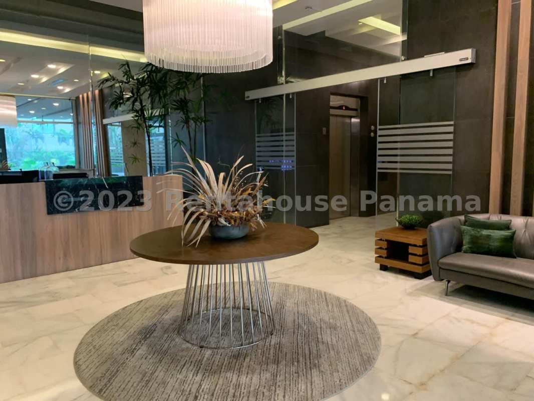 Bright open living area with floor-to-ceiling Pacific Ocean view windows in PH Oceanaire Punta Pacifica