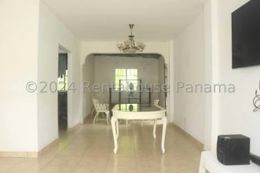 Kitchen space with ceramic tile backsplash and laminate countertops in La Isabella house Panama