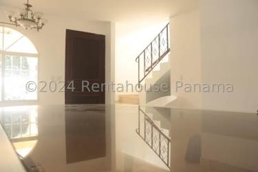 Bright entrance with staircase and chandelier at La Isabella gated house Arraiján Panama