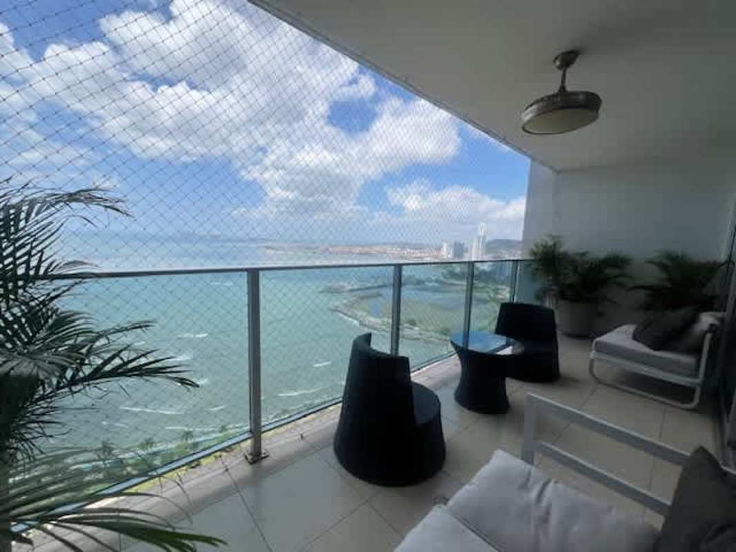 Private balcony with views of Pacific Ocean and city skyline at PH Waterfront Panama