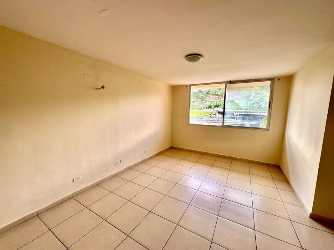Living room with large tile floors and big window PH Mallorca Park Village Los Andes Panama