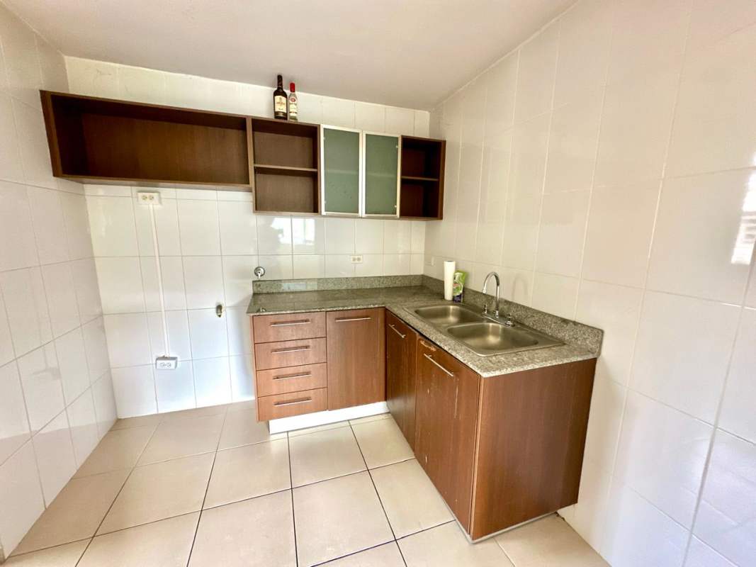 Kitchen with granite counters and wood cabinets PH Mallorca Park Village Los Andes Panama