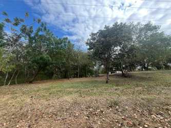 Vacant flat coastal land for sale in gated Costa Esmeralda San Carlos Panama Oeste