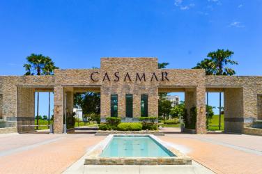 Modern living dining room with terrace access overlooking golf and Pacific Ocean in Casamar Panama