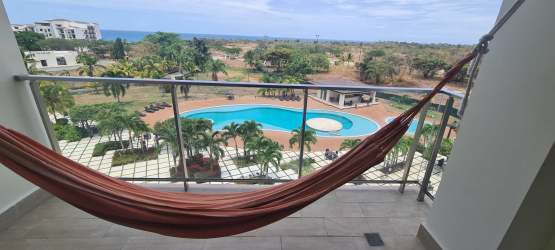 Bedroom with large sliding doors to terrace, sea and golf views, AC and modern furnishings in Casamar San Carlos Panama