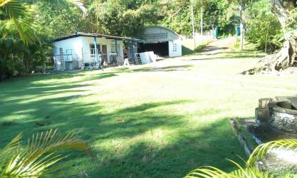 Detached small home and lush tropical trees in Colon Panama estate