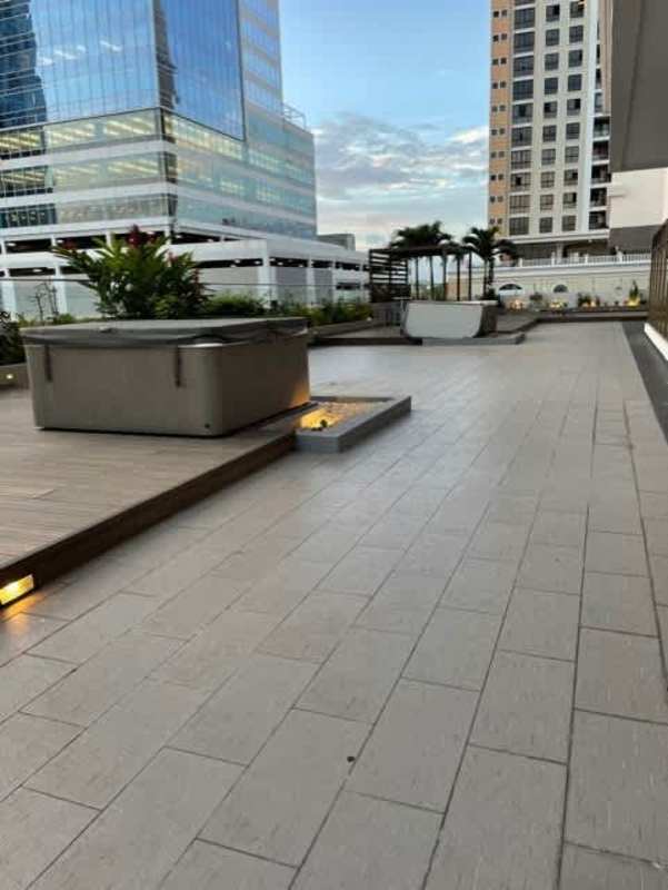Rooftop with hot tub fire feature planter boxes city skyline PH Brisa Marina Costa del Este