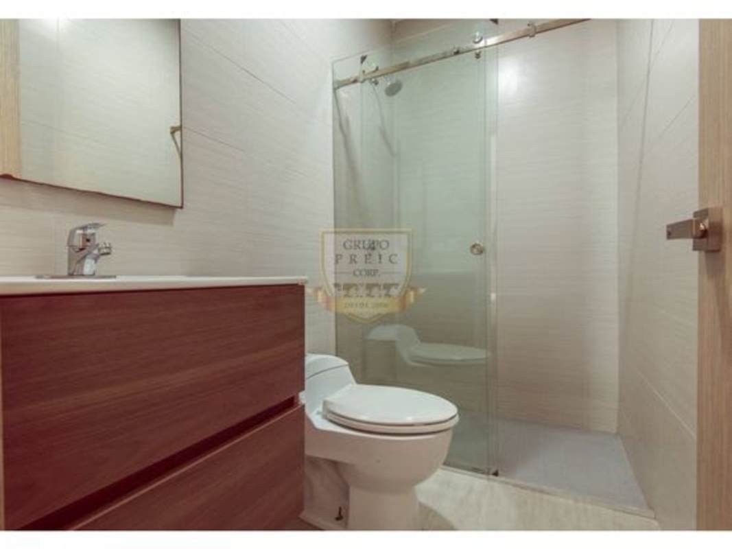 Modern bedroom with built-in closets tile floor in Residencial Costamare apartment Costa Sur Panama