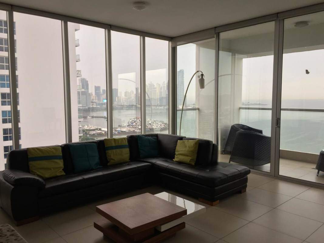Luxury bedroom with large windows, city skyline view in PH Rivage Tower Panama City