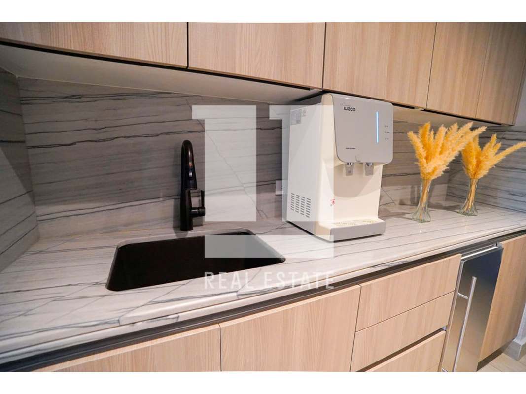 Spacious modern luxury kitchen with marble counters, custom cabinetry at PH Pradera Panama City